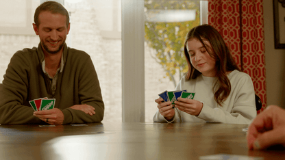 Dad, smiling, and Daughter playing SWOOP