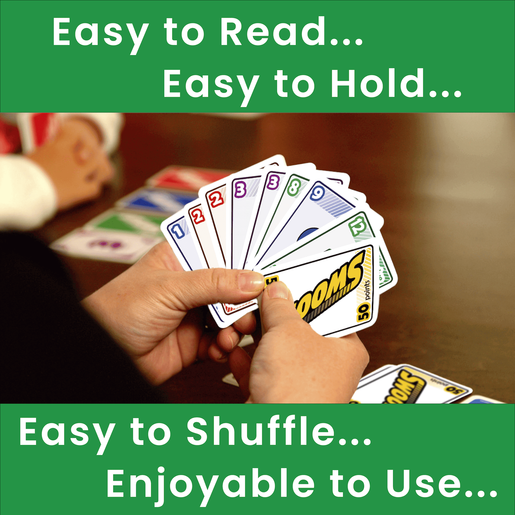 Hand holding playing cards with text about card features on a green background